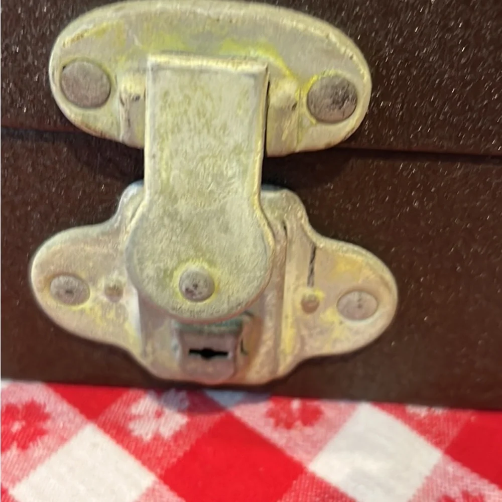 Vintage tin movie reel container with lock